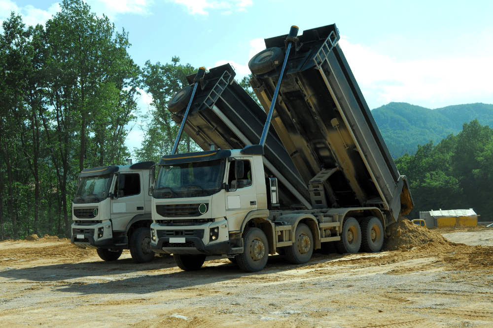 Pair of Total Waste Services tippers tipping muck at a licensed facility