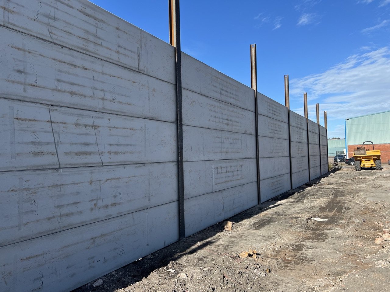 Completed five metre concrete panel perimeter wall with RSJ posts at a Wolverhampton commercial site