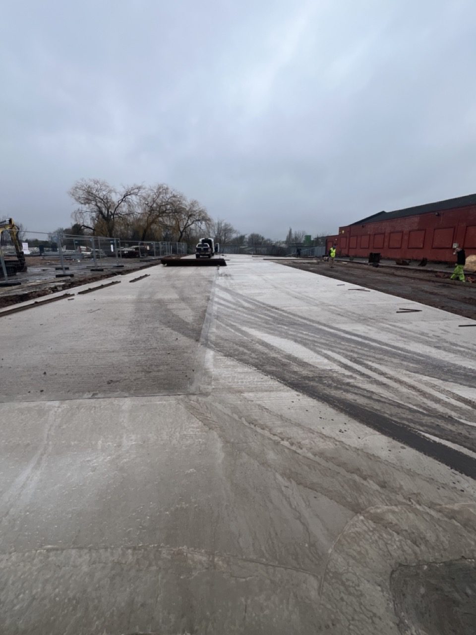 Completed industrial concrete hardstanding at a Wolverhampton commercial yard after repair