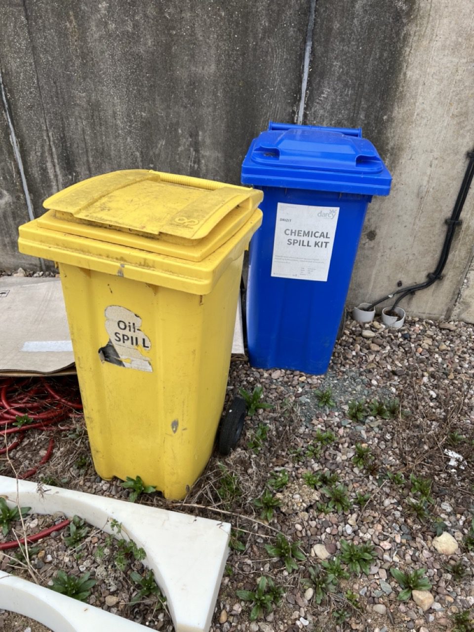 Chemical waste and spill kit bins ready for compliant hazardous collection