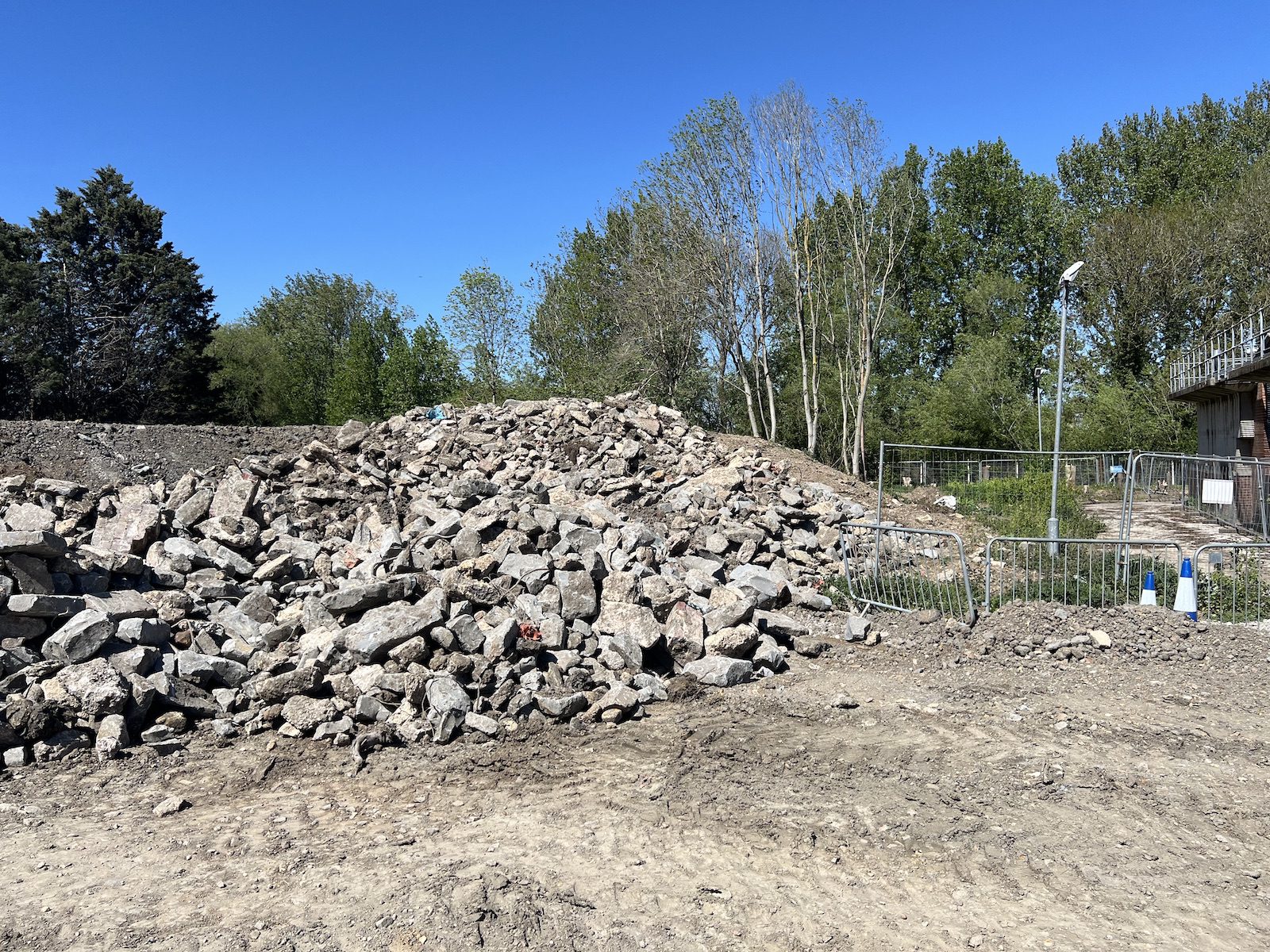 Large stockpile of clean crushed concrete and stone hardcore segregated for recycling