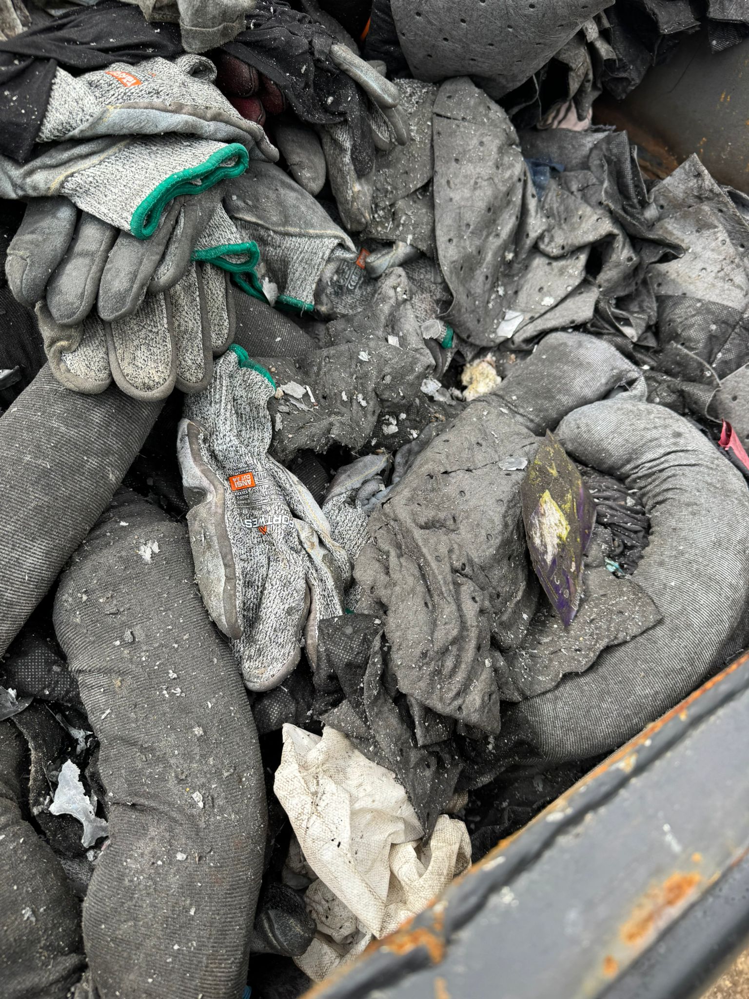 Waste oils and oily rags contained for hazardous disposal